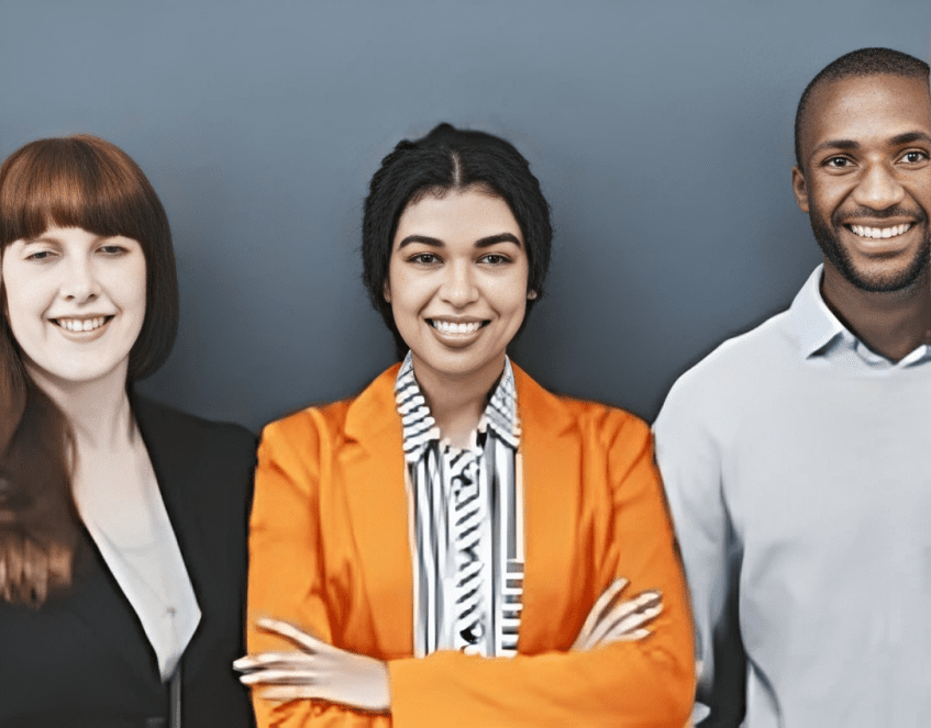 Multicultural group posing against blue background